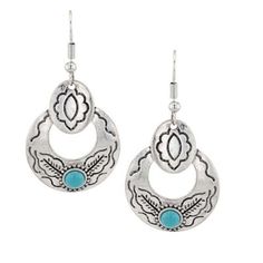 Stand out from the rest with the Subtle Southwest Attitude Earrings. These earrings feature an innovative design. The earrings pair traditional Southwest patterns and blend them with a modern design. The earrings design features a thick hoop design with a shield like design. The silver tone hoop design has black southwestern inspired lines flowing throughout the design. At the bottom of the earring is a timeless turquoise stone with a beaded border. These earrings have hypoallergenic French wires for easy wear. Stone color may vary. All Montana Silversmiths jewelry and accessories are coated with Montana Armor to prevent tarnish. These earrings have French wires allowing for easy movement. Add some Southwest style and attitude to your outfit. Turquoise and silver finish are the perfect pai Montana Silversmith Jewelry, Southwest Jewelry, Hoop Design, Earrings Design, Tractor Supply, Southwest Style, French Wire, Jewelry And Accessories, Accessories Jewelry Earrings