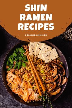 a bowl filled with noodles and vegetables next to chopsticks on top of it