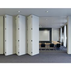 an empty conference room with white partitions