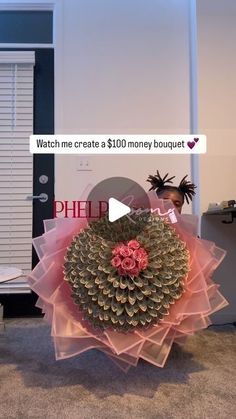 a pink flower sitting on top of a carpet covered floor