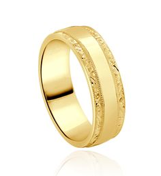 a yellow gold wedding ring with engraved details