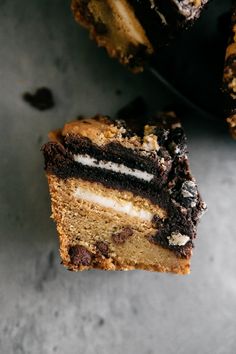 two pieces of cake sitting on top of each other