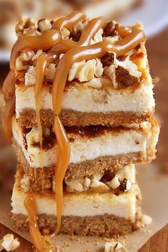 three desserts stacked on top of each other with caramel sauce drizzled over them