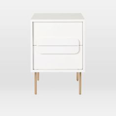 a white cabinet with two drawers and wooden legs on the bottom one drawer is open