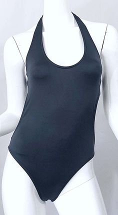 For Sale on 1stDibs - Sexy never worn 90s vintage CALVIN KLEIN slate grey one piece cut-out swimsuit or bodysuit! The perfect alternative to black, this beauty features just Black Second-skin Bodysuit For Poolside, Black Second-skin Bodysuit For Pool, Black Sleek Leotard For Summer, Black Sleek Summer Leotard, Calvin Klein Swimwear For Swimming, Black Second-skin Bodysuit For Beach, Black Second-skin Bodysuit For The Beach, Black Second-skin Fit Bodysuit For Beach, Calvin Klein Stretch Swimwear For Poolside