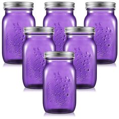 six purple mason jars with silver lids