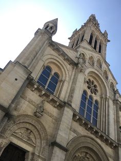 an old church with two clocks on it's side