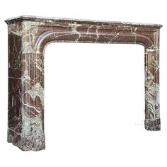 a marble fireplace surround in the shape of an arch