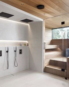 a modern bathroom with wood and white walls