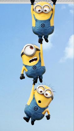 three minion shaped kites flying in the sky