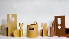 several different shapes and sizes of wooden objects