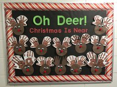 a bulletin board with reindeer handprints and the words oh deer christmas is near