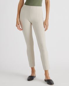 If work pants and yoga pants had a kid - this would be it. Part of our best-selling ponte pants collection, this stretchy, double knit style is cropped at the ankle and designed with a slim leg and seamwork detailing for a streamlined effect. Plus, they’re equally appropriate for the office or the couch.  | Quince | Women's Ultra-Stretch Ponte Pintuck Ankle Pants in Ecru, Size Small, Rayon Best Work Pants, Black Minimal, Ponte Fabric, Ecru Color, Ponte Pants, Quarter Zip Sweater, Double Knit, Slim Leg, Pin Tucks