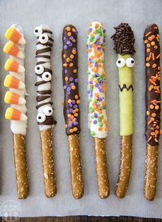 five different types of candy sticks with faces on them