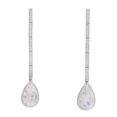 Pear shape drop earrings with the halo. Made in platinum and 18k white gold, set with 142 round brilliant cut diamonds, total weight 0.65 carats color: E-F, clarity: VS, with suspended with two GIA certified diamonds 3.02carat and 3.03 carat Both pear shape diamonds are G.I.A certified D-color and VS2- GIA# XXXXXXX GIA#XXXXXXX NALLY JEWELS White Diamond Jewelry, White Gold Set, Diamond Drops, Diamond Drop Earrings, Pear Shaped Diamond, Antique Earrings, Gia Certified Diamonds, Gold Set, Gia Diamond