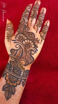 the hand is decorated with intricate designs