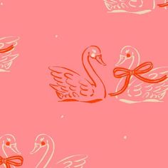 a pink background with swans and bows on it