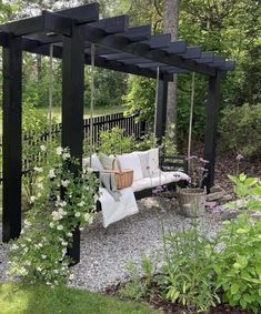 a white couch sitting on top of a wooden swing