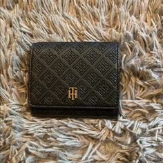 Tommy Hilfiger Women's Wallet. The Wallet Snaps Open To Reveal Ample Space For Your Cards And Currency. Adorned With The Brand’s Gold Signature Medallion And Monogram Logo Throughout And A Small Chain Inside. There Is Also A Spot For Coins. The Wallet’s Body Is Made Out Of Synthetic Leather. It Has No Visible Flaws. The Price Is Negotiable. If You Have Any Questions Please Do Not Hesitate To Ask! Measurements: Length: .32 Inches Width: .36 Inches Tommy Wallet, Tommy Hilfiger Bags, Tommy Hilfiger Women, Monogram Logo, Chanel Boy Bag, Passport Holder, Synthetic Leather, Wallets For Women, Making Out