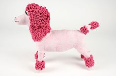 a pink poodle stuffed animal on a white background