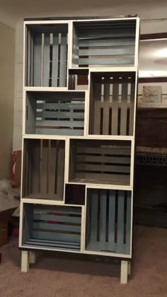 a bookcase made out of wooden slats