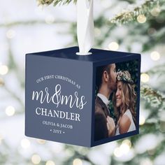 an ornament hanging from a christmas tree with a photo on it and the words, our first christmas as mrs chandler