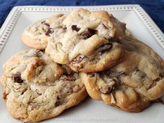 a white plate topped with chocolate chip cookies