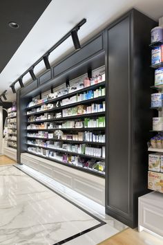 an empty pharmacy room with shelves full of medicine