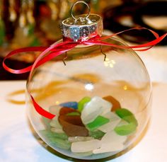 a glass ornament filled with lots of candy