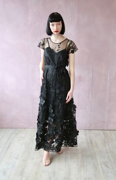 Black Flowers Embroidered All Occasions. Black Embroidered Summer Party Dress, Black Embroidered Dress For Summer Party, Floral Embroidered Short Sleeve Evening Dress, Black Dresses With Floral Applique For Spring, Evening Floral Embroidered Short Sleeve Dress, Short Sleeve Embroidered Dress With Floral Embroidery For Evening, Black Fitted Dress With Floral Applique, Elegant Black Embroidered Short Sleeve Dress, Elegant Black Short Sleeve Embroidered Dress