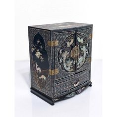 Splendid antique Chinese black lacquer jewelry box with exquisite workmanship. Intricate mother of pearl inlay with brilliant iridescent qualities throughout. The front face is a scene depicting opposing dragons battling over the flaming pearl in the heavens/clouds. The top and sides with scenes of a pair of deers in a beautiful landscape with birds flying overhead with further flowers & fruits.  All highly symbolic and fortuitous. Very unusual bat-form drawer pulls.  The starburst style geometr Inlay Jewelry, Double Dragon, Antique Jewelry Box, Mother Of Pearl Inlay, Pearl Inlay, Front Face, Dragon Jewelry, Black Lacquer, Asian Antiques