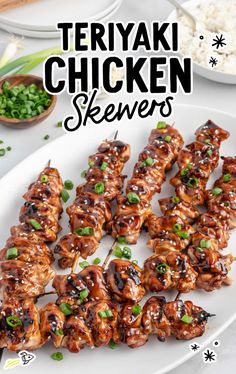 teriyaki chicken skewers on a white plate