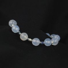 You'll love the delicate deign and beautiful slightly transparent stones in our light blue lace agate bracelet! Perfect if your looking for an accessory with just a hint of blue! ABOUT: * Materials: sterling sliver lobster claw and sterling silver 1.5 inch extension * Beads: lace agate, glass beads, sterling silver * Width: 8mm SHOP OUR BRAND > https://rosaperlina.etsy.com WHAT IS STERLING SILVER? * Sterling silver is a mix of 92.5% of silver and 7.5% of other metals, typically copper. * The added copper gives sterling silver a great durability and strength. * Benefits are durability, higher percentage of real silver and better for sensitive skin. HOW TO CARE FOR STERLING SILVER? * Keep in an airtight container, away from moisture, heat, and sun in storage * Keep away from household chemic Blue Bridal Jewelry, Blue Lace Agate Bracelet, Something Blue Bridal, Clean Sterling Silver, Blue Bridal, Agate Bracelet, Blue Lace Agate, Bracelet Argent, Bracelet For Women