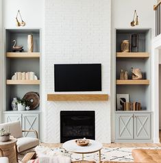 the living room is clean and ready to be used as a media center or office