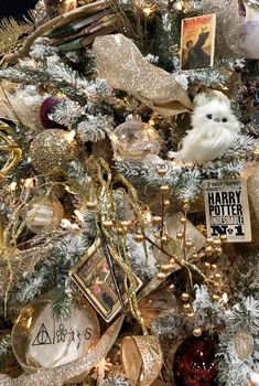 a christmas tree is decorated with gold and silver ornaments