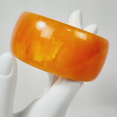 Good preowned condition, normal vintage wear. It has a 2 1/2" inner diameter and is 1 5/16" wide. Please see pictures for details. Vintage Resin Bangle, Natural Amber, Vintage Wear, Swirl, Bangle Bracelets, Favorite Jewelry, Jewelry Bracelets, Bangles, Orange