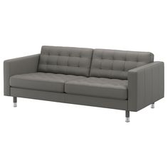 a gray leather couch sitting on top of a white floor