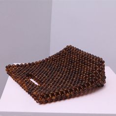 Shape: Doggy Bag Style Pattern Type: Tortoise Shell Style Main Material: Resin Beads Lining Material: Polyester Hardness: HARD Dimensions 14 x 7 x 20 cm Brown Beaded Pouch Bag, Beaded Brown Bags As Fashion Accessory, Brown Beaded Handheld Bag, Brown Beaded Pouch Shoulder Bag, Handheld Brown Beaded Bag, Daily Use Brown Beaded Bags, Brown Beaded Bags For Daily Use, Beaded Brown Shoulder Bag Gift, Doggie Bag