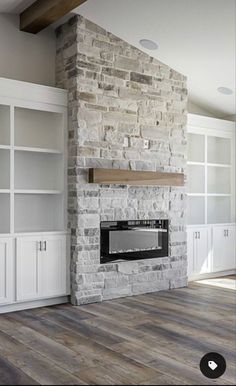 a living room filled with furniture and a fire place in the middle of a room