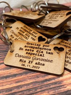 some brown tags with names on them sitting on a table