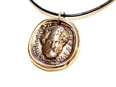 "Marcus Aurelius Necklace, Memento Mori, Stoicism Jewelry, Wax Seal Intaglio, Stoic Coin Pendant, Roman Emperor Statue, Philosopher King Bust This unique and detailed handmade product is a beautiful bronze charm necklace inspired by the antique bust statue of the Roman Emperor Marcus Aurelius.   Product Details - Approximate size: 2.5 cm (1\"), without the bail ring.  - Material: Solid Antique Bronze. - Adjustable waxed cotton or leather cord. - Nickel and lead free. - Handmade intaglio pendant. *The pendant has been through an oxidization process with a liver of sulfur for an antique and vintage look.   *All products are handmade with our original intaglio seal designs created at Vess Design studio at Bulgaria, Europe. * Each product is made by hand individually thus size and color may va Antique Bronze Coin Necklace, Momento Mori Coin, Ancient Bronze Necklace With Coin Pendant, Ancient Bronze Medallion Necklace, Roman Coin Necklace, Marc Aurèle, Bust Statue, Jewelry Wax, Roman Emperor