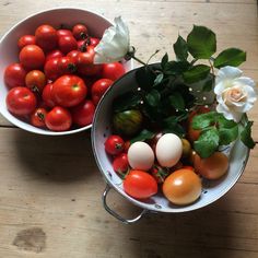 two white bowls filled with tomatoes and other vegetables