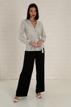 "The white sequined wrap blouse has a modern and stylish look. Our glamorous blouse with its sparkle is an extremely stylish and elegant choice for formal evenings such as cocktails, weddings and all-night/day invitations. The blouse, which is a coupon piece that you should have in your closet, can be combined with sequined twin trousers, baggy and tight classic trousers or jeans. It easily adapts to your body with the shawl model. It is tied around the waist with a belt. S/36 Length from underarm: 43cm/16.9\" Length from Shoulder: 66cm/25.9\" M/38 Length from underarm: 44cm/17.3\" Length from Shoulder: 67cm/26.4\" L/40 Length from underarm: 45cm/17.7\" Length from Shoulder: 68cm/26.8\" XL/42 Length from underarm: 46cm/18.1\" Length from Shoulder: 69cm/27.2\" 2XL/44 Length from armpit: 47c Glamorous V-neck Party Blouse, Glamorous V-neck Sequin Fabric For Evening, Festive V-neck Evening Blouse, Glamorous V-neck Sequin Fabric For Wedding, Elegant Fitted V-neck Sequin Fabric, Elegant Long Sleeve Sequin Dress For Night Out, Elegant Contrast Sequin Fabric For Night Out, Elegant V-neck Tops For Festive Occasions, Festive Chic Tops With Contrast Sequin