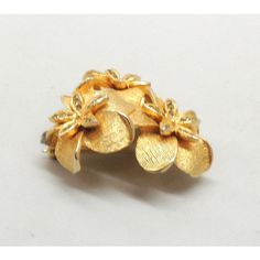 This is part of Chairish’s Costume Jewelry assortment.  1960s three goldtone textured flowers with small round clear rhinestone accents brooch with security clasp. Marked "DeNicola." Measures: 1 3/4 inches long by 1 3/4 inches wide. Condition: Very good; there is some wear to the edge of two flowers, but due to the design it's hard to see.  Please reference the measurements noted in the description above for the best approximate dimensions. Please reach out to the seller under "Ask the Seller" f Gold Flower Brooch For Evening, Gold Costume Jewelry Brooch For Anniversary, Gold Clip-on Costume Jewelry Brooch, Gold Clip-on Brooch For Wedding, Gold Clip-on Brooches For Wedding, Rhinestone Brooches, Clear Rhinestones, Vintage Brooches, Costume Jewelry