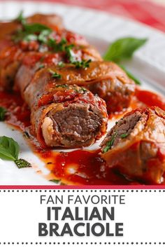 a plate topped with meat covered in sauce and garnished with parsley leaves