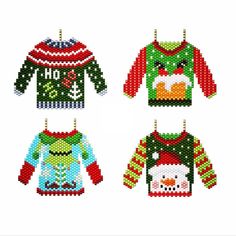 cross stitch christmas sweaters hanging on clothes pins