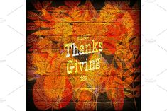 an autumn background with leaves and the words thank giving in gold on a black brick wall