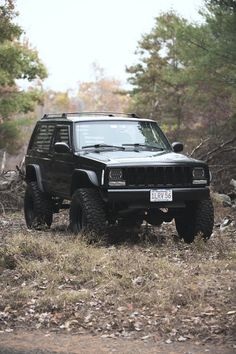 a jeep is parked in the middle of a field