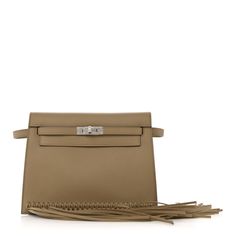 This is an authentic HERMES Swift Kelly Danse Anate Fringed Belt Bag in Beige Marfa. This chic waist bag is finely crafted of smooth dark beige leather. This belt bag features an adjustable strap and a frontal flap with a classic silver Hermes Kelly turn-lock and fringe that open to a matching leather interior with a small patch pocket and a removable base. Luxury Beige Leather Belt Bag, Kelly Danse, Fringed Belt, Dark Beige, Waist Bag, Leather Interior, Belt Bag, Patch Pocket, Swift