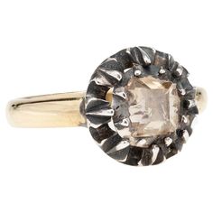 An interesting diamond conversion ring from the Victorian (ca1850s) era! Crafted in 18kt yellow gold and topped in beautifully patinaed sterling silver, this ring adorns a unique Table Cut diamond in a closed-back collet setting. The Table Cut diamond catches the light gently, making for a very special look. The collet is raised, held by an elegant belcher setting. A simple contemporary 18kt band completes the ring, breathing new life into this beautiful Georgian piece. This ring would be a wond Victorian Conversion, Georgian Ring, Brilliant Cut Diamond Ring, Ring Fit, Diamond Cluster Ring, Contemporary Jewellery, Bezel Diamond, Contemporary Jewelry, Antique Rings